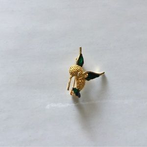 Vintage hummingbird with enamel on the wings and tail, rhinestone eye. Pre-owned